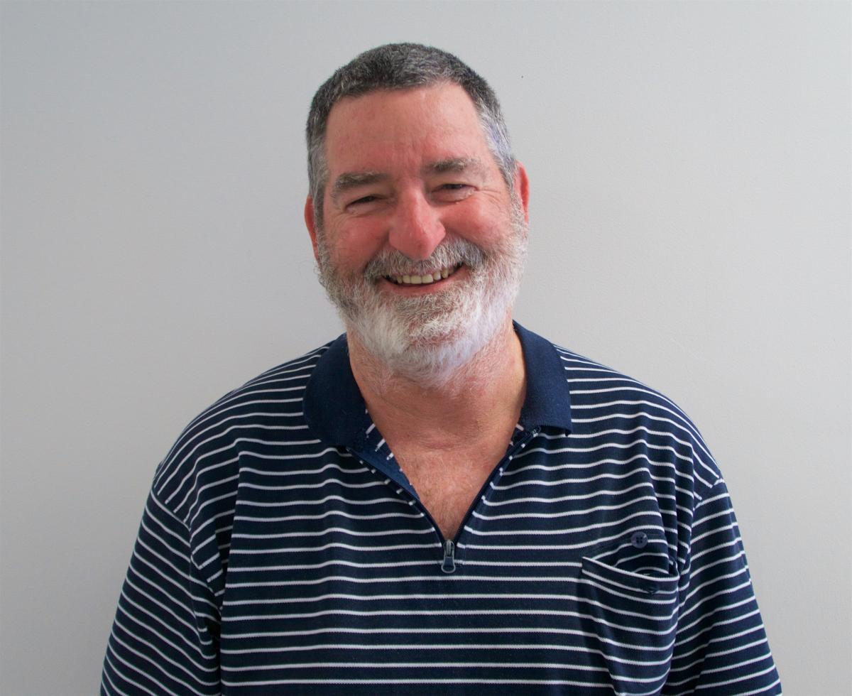 Portrait of Mark Thompson, Community Educator, smiling at the camera